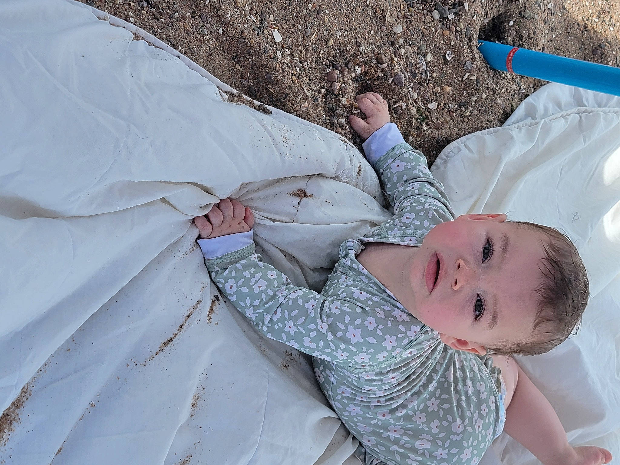 Myah is registered to the contest to win money with this photo: arm, baby, baby_toddler_clothing, child, comfort, elbow, fun, grass, hat, leisure, linens, person, recreation, soil, textile, toddler, tree, vacation