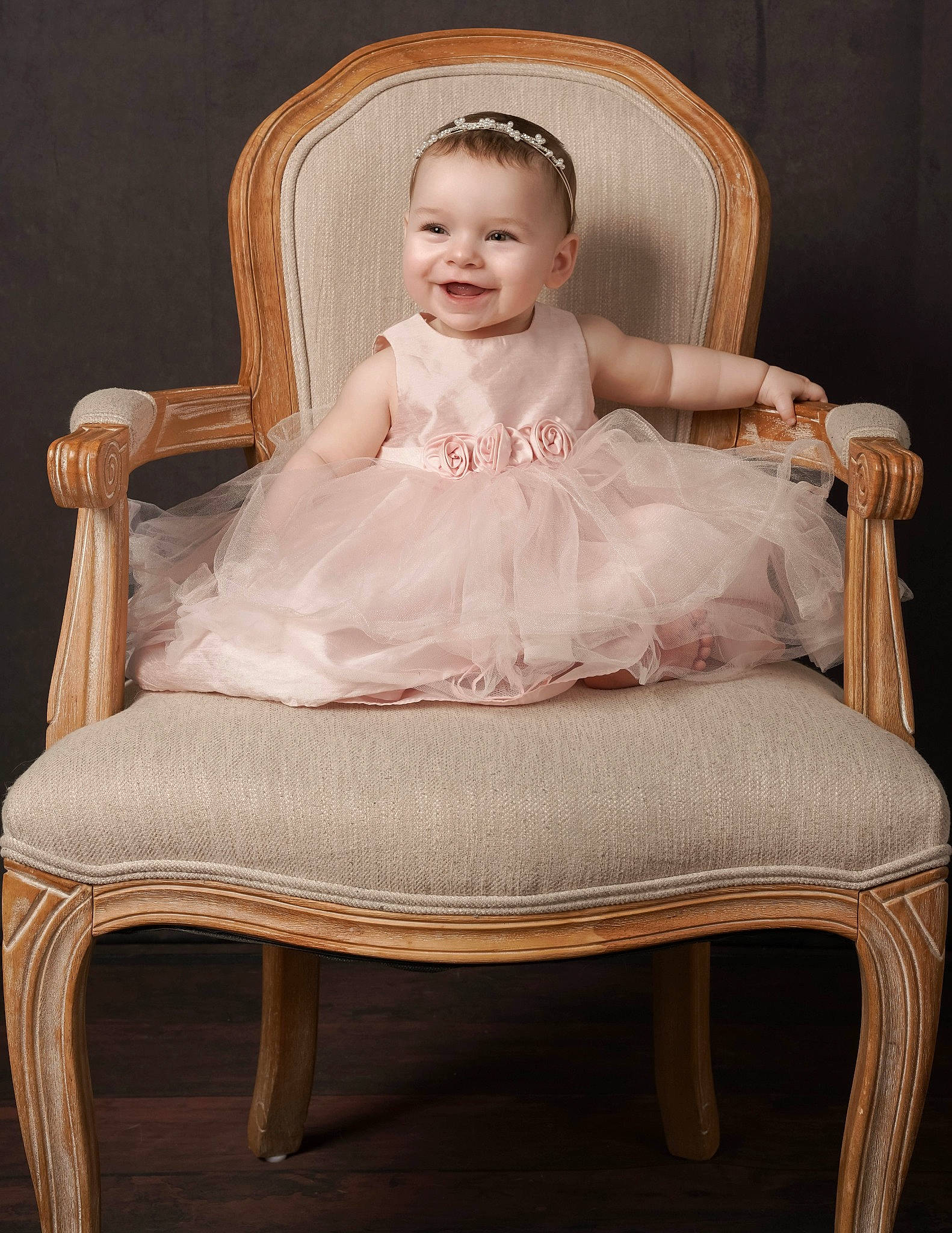 Myah is registered to the contest to win money with this photo: baby, baby_toddler_clothing, chair, cheek, comfort, embellishment, eye, face, fashion_accessory, flash_photography, furniture, hair, hardwood, head, human_body, iris, joy, person, sitting, smile