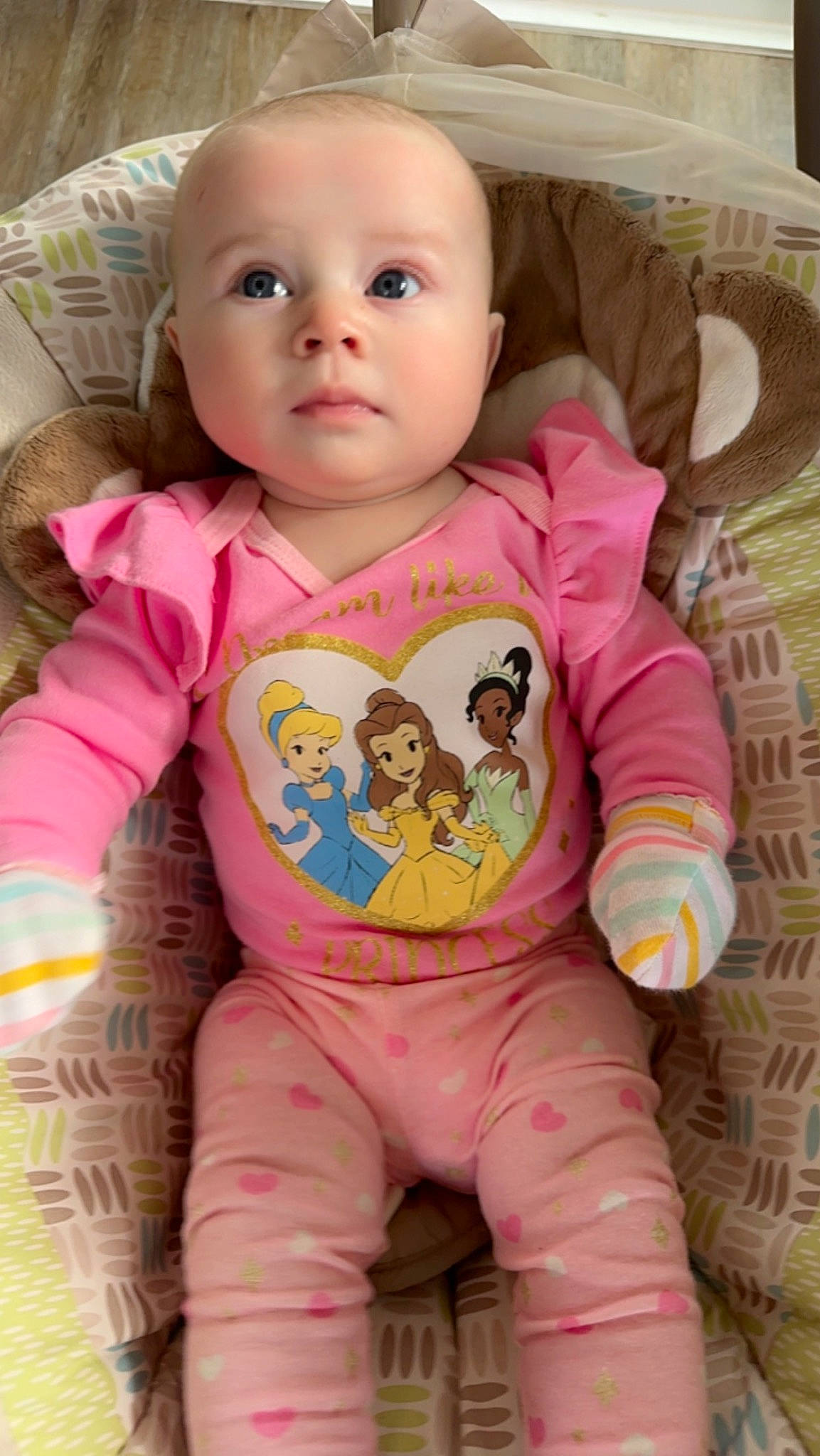 Mackenzie is registered to the contest to win money with this photo: arm, baby, baby_toddler_clothing, cheek, chin, eye, eyebrow, face, facial_expression, forehead, head, human_body, lip, mouth, neck, nose, outerwear, person, skin, sleeve