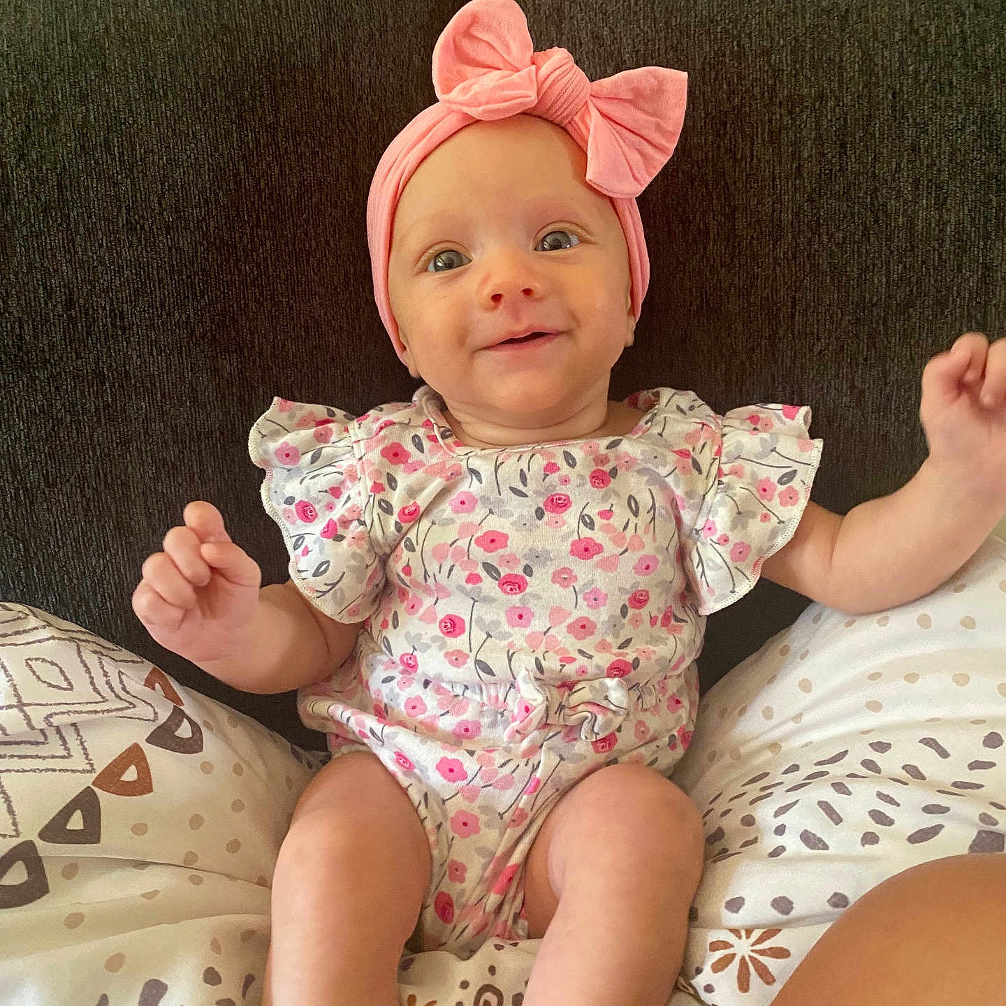 Skyla is registered to the contest to win money with this photo: accessories, baby, bed, cap, clothing, couch, cushion, face, furniture, hat, head, homedecor, indoors, newborn, person, photography, portrait, shorts, sitting, t_shirt