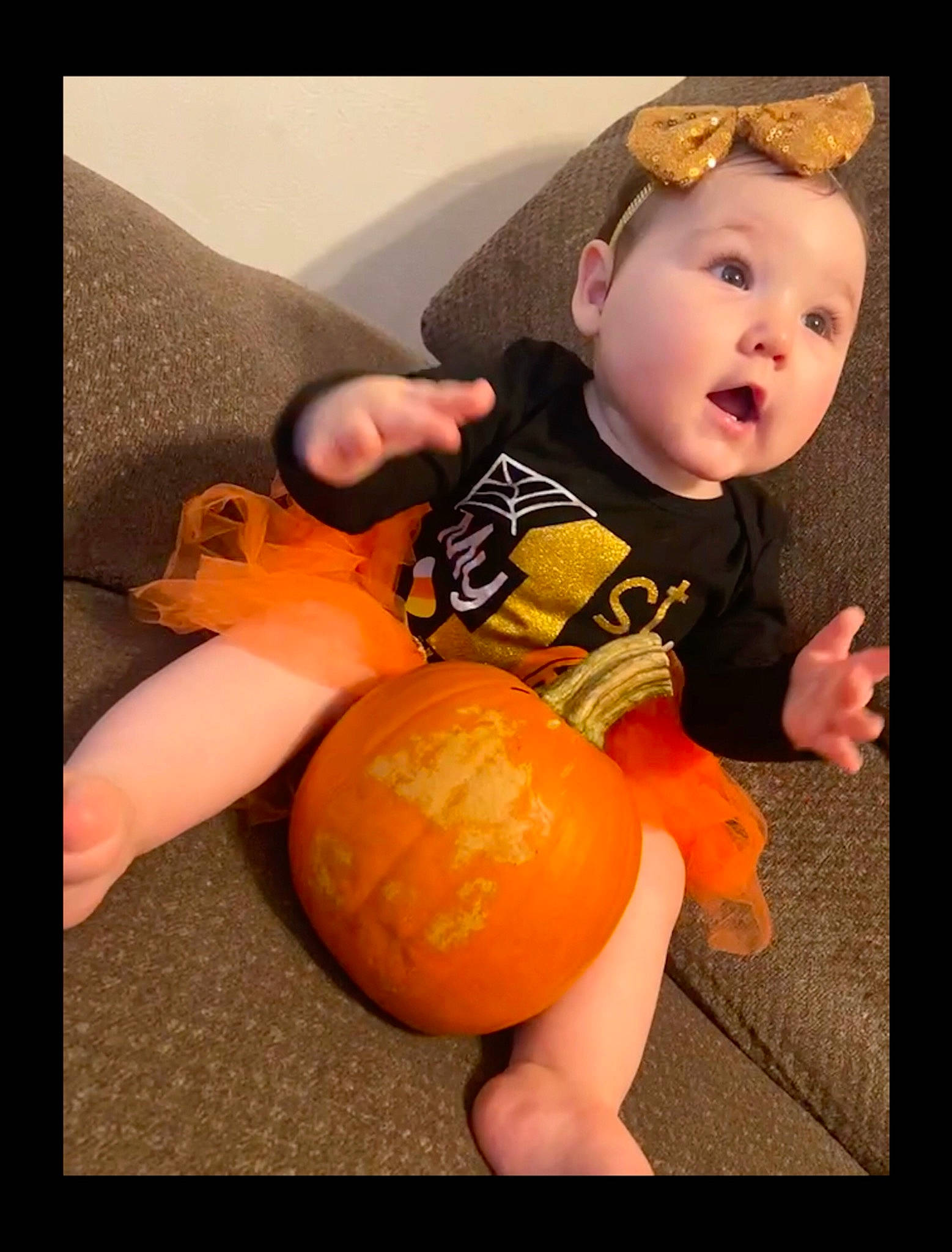 Sophia joined the competition — help win amazing prizes! baby, baby_playing_with_toys, baby_products, baby_toddler_clothing, baby_toys, child, finger, hair_accessory, hand, headband, headpiece, nose, orange, person, play, surprise, thumb, toddler, toy