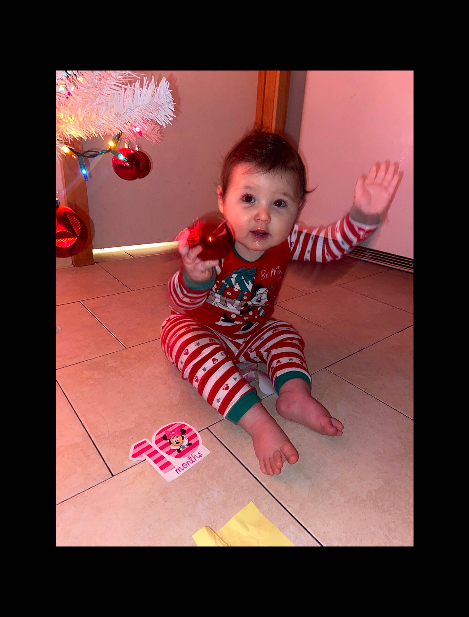 Sophia joined the competition — help win amazing prizes! baby, baby_toddler_clothing, christmas, finger, floor, flooring, foot, hand, nail, nightwear, ornament, person, play, sock, thumb, toddler, toe