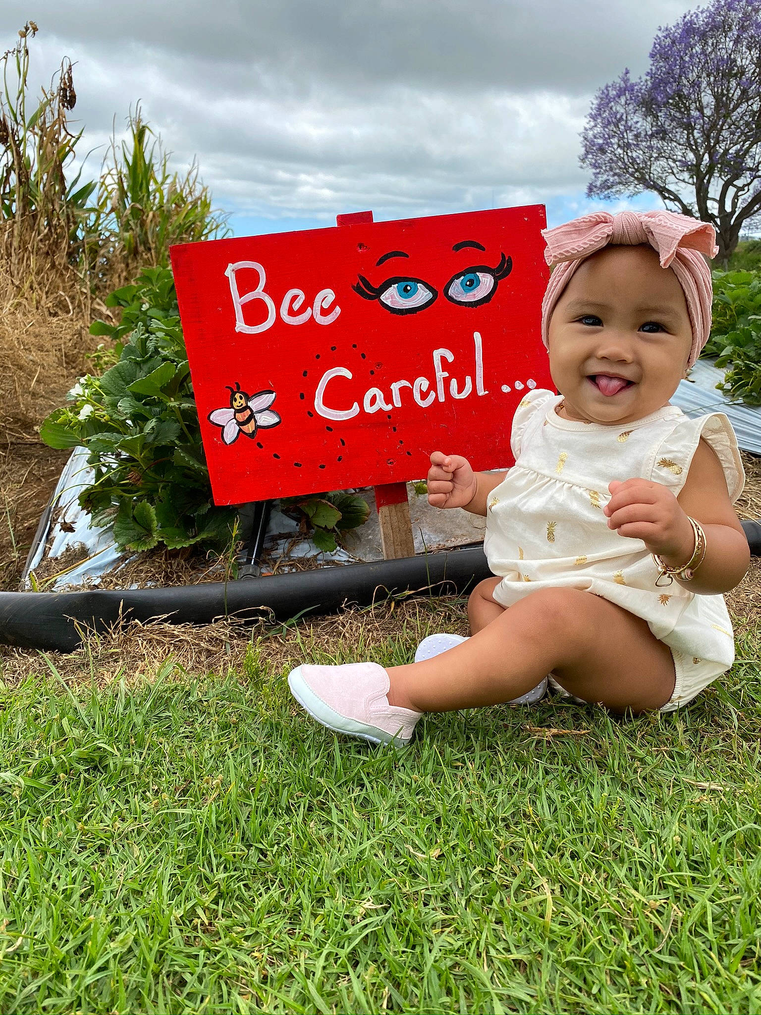 Kailea joined the competition — help win amazing prizes! baby, child, fun, garden, grass, grass_family, happy, headwear, joy, lawn, person, plant, sign, signage, skin, smile, summer, toddler, tree, vacation