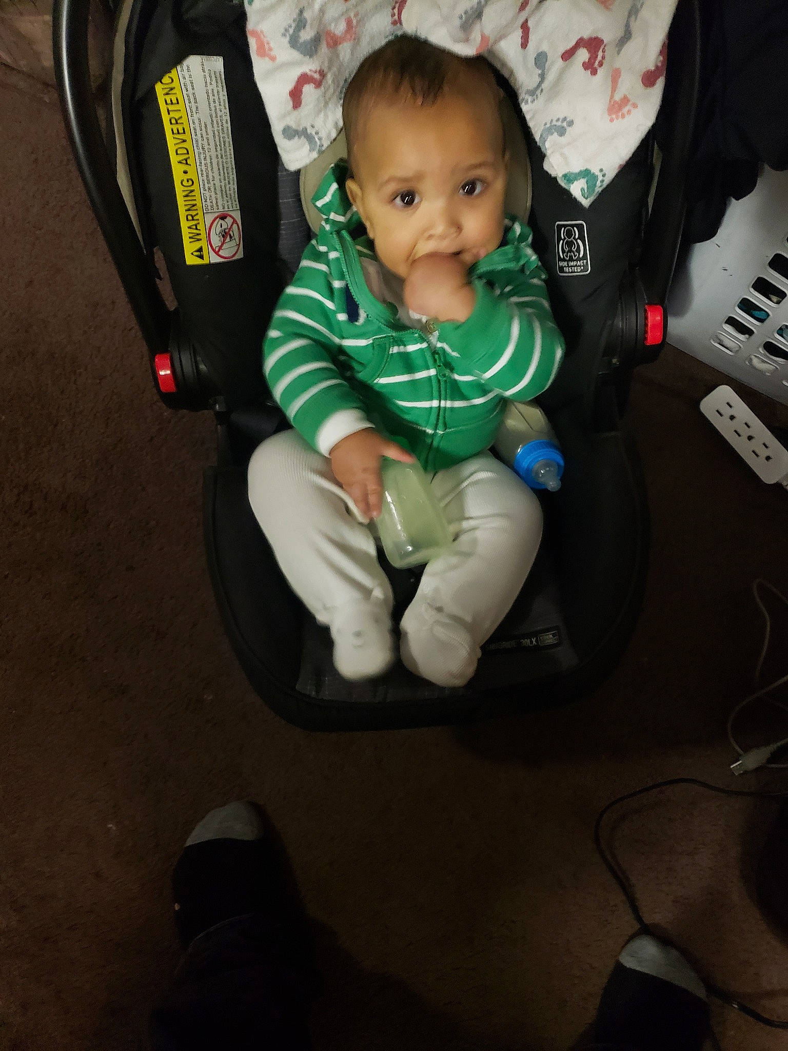 Darrell is registered to the contest to win money with this photo: arm, baby_carriage, baby_products, car_seat, child, cool, fun, infant, person, personal_protective_equipment, play, product, sitting, space, technology, toddler