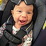 Izabella is registered to the contest to win money with this photo: baby, smiling, car_seat, bow, child, infant, safety_harness, happy, closeup, seatbelt, cute, apparel, portrait, indoors, child_safety, headwear, fabric, seat, person, expression
