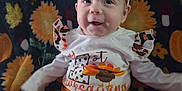 Izabella is registered to the contest to win money with this photo: autumn, baby, blanket, celebration, child, clothing, cute, fall, happy, headband, holiday, indoors, infant, orange, pattern, person, portrait, pumpkin, sitting, smile