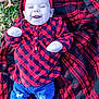 baby, infant, smiling, red_headband, plaid_shirt, blue_jeans, outdoor, grass, blanket, cute, happy, child, fall_leaves, casual_clothing, headwear, fashion, portrait, lying_down, nature, warm_clothes