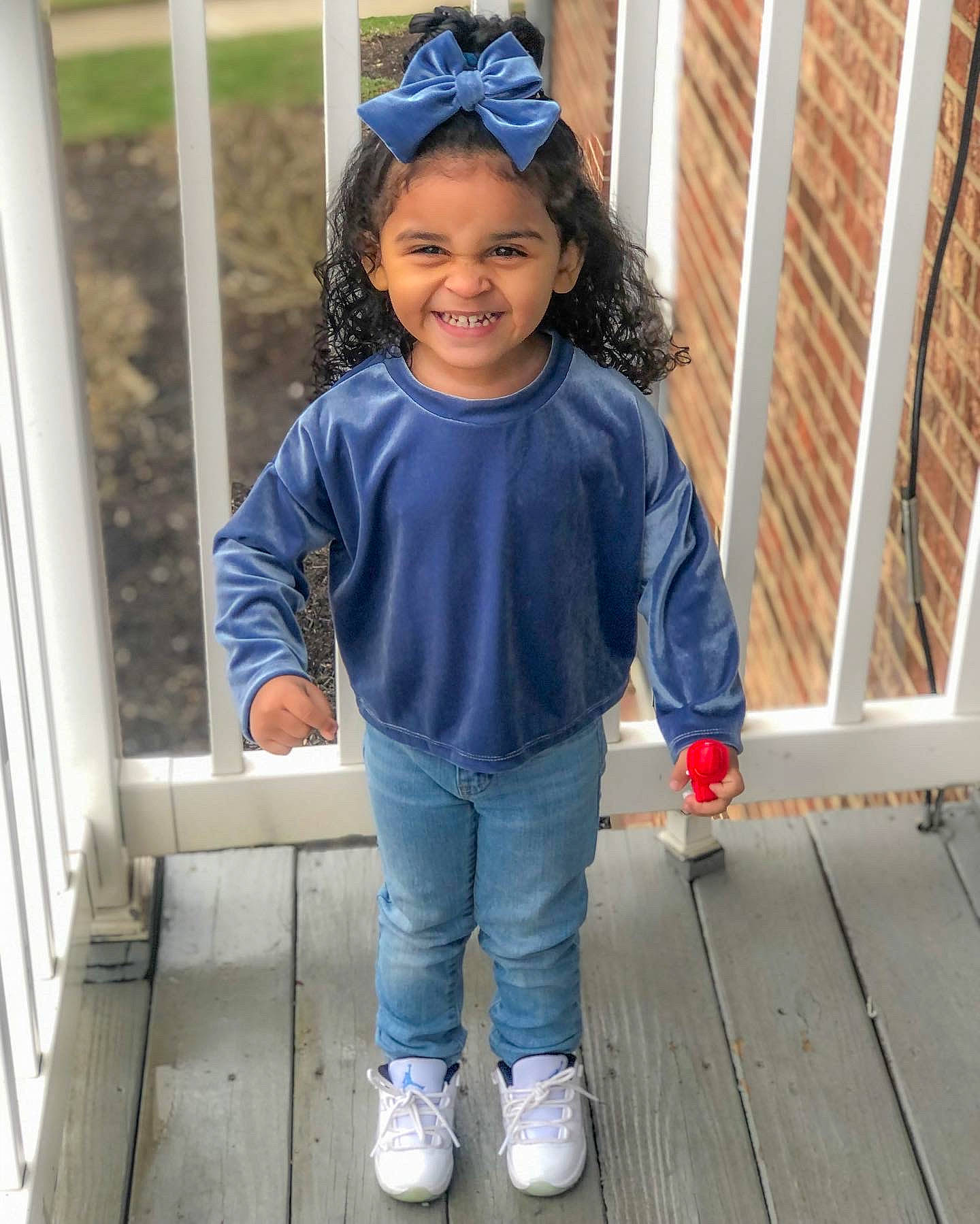 Naomi is registered to the contest to win money with this photo: baby_toddler_clothing, child, clothing, denim, electric_blue, face, fun, happy, joy, leisure, pattern, person, sitting, sleeve, smile, standing, street_fashion, t_shirt, thigh, toddler