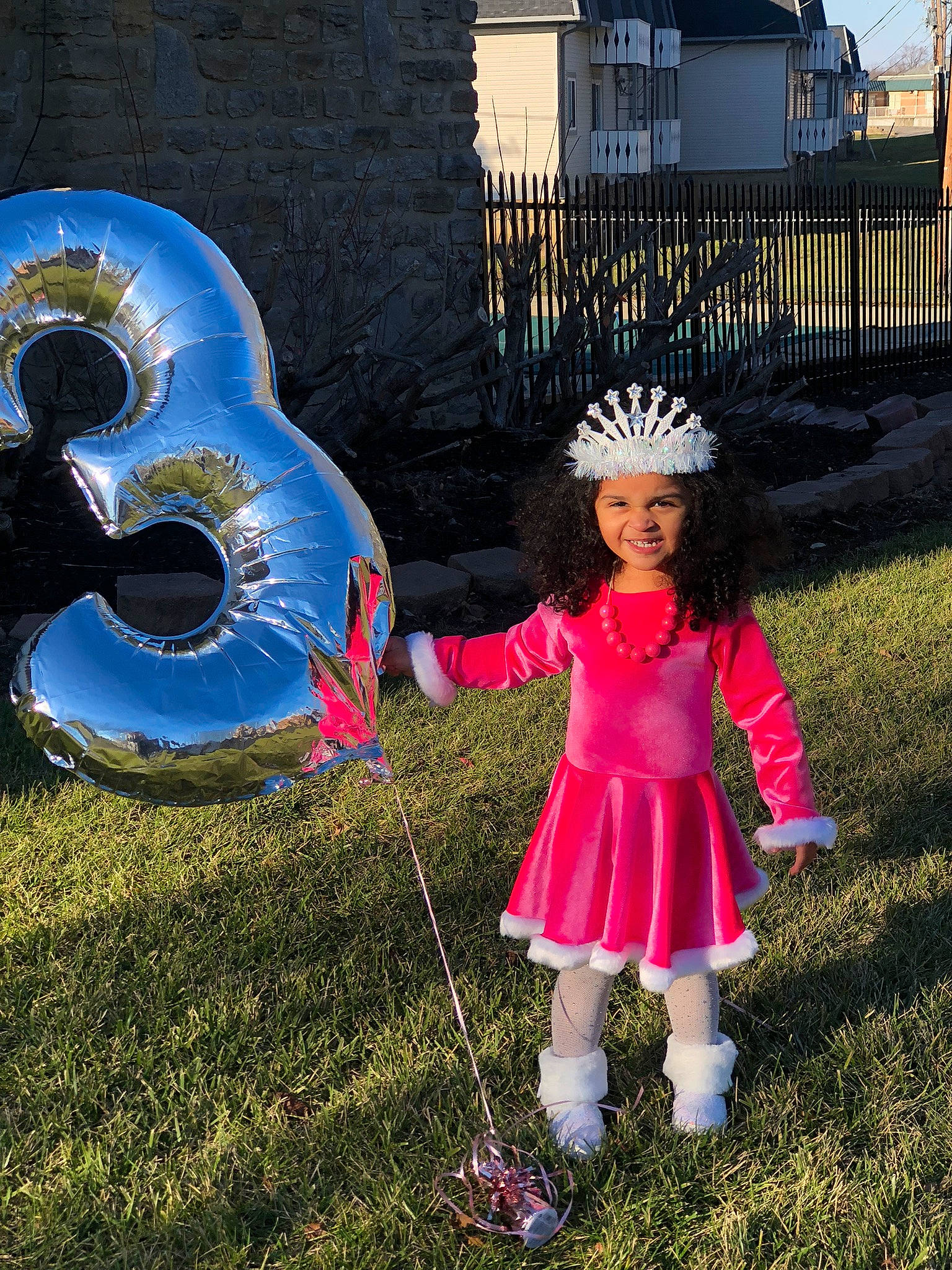 Naomi is registered to the contest to win money with this photo: automotive_wheel_system, brass_instrument, electric_blue, fashion_accessory, fence, fun, grass, happy, hat, headpiece, headwear, idiophone, joy, leisure, magenta, musical_instrument, people_in_nature, person, plant, pole