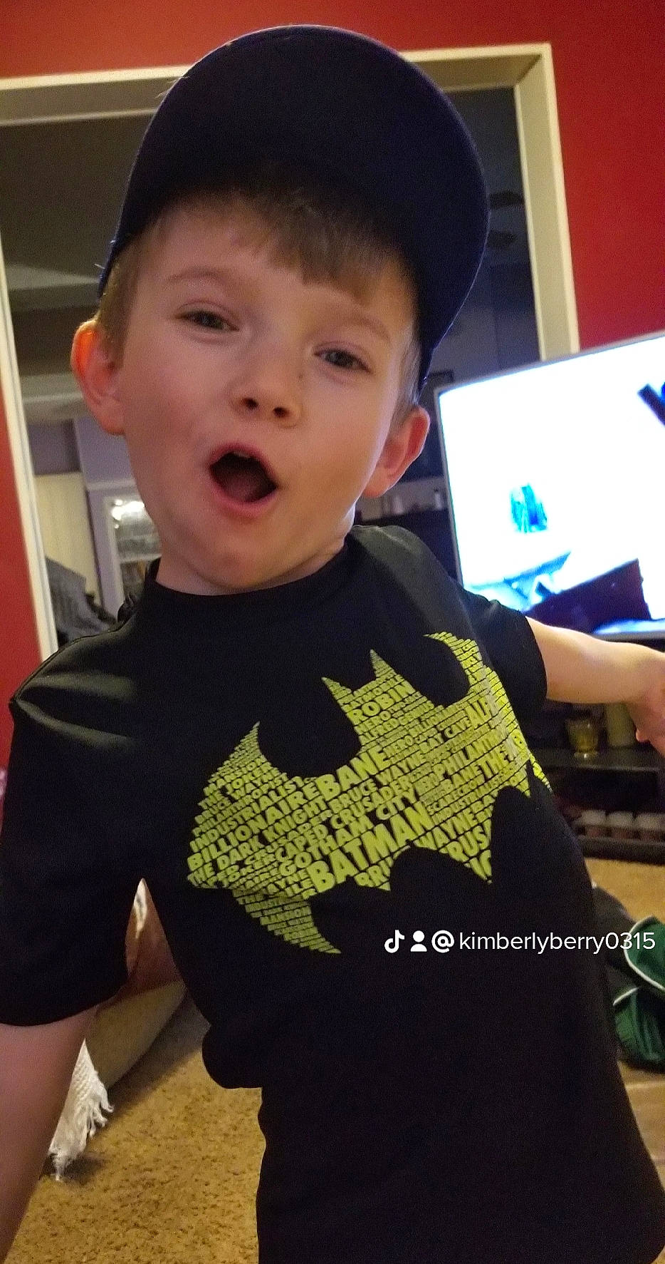 Caleb is registered to the contest to win money with this photo: art, baby_toddler_clothing, cap, child, cool, electric_blue, eye, fashion_accessory, finger, fun, gesture, happy, hat, person, sleeve, smile, sportswear, standing, t_shirt, thumb