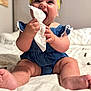 baby, bed, blue_dress, child, chubby, cozy, cute, feet, hands, happy, headband, indoors, infant, person, portrait, sitting, skin, smiling, soft_light, tissue