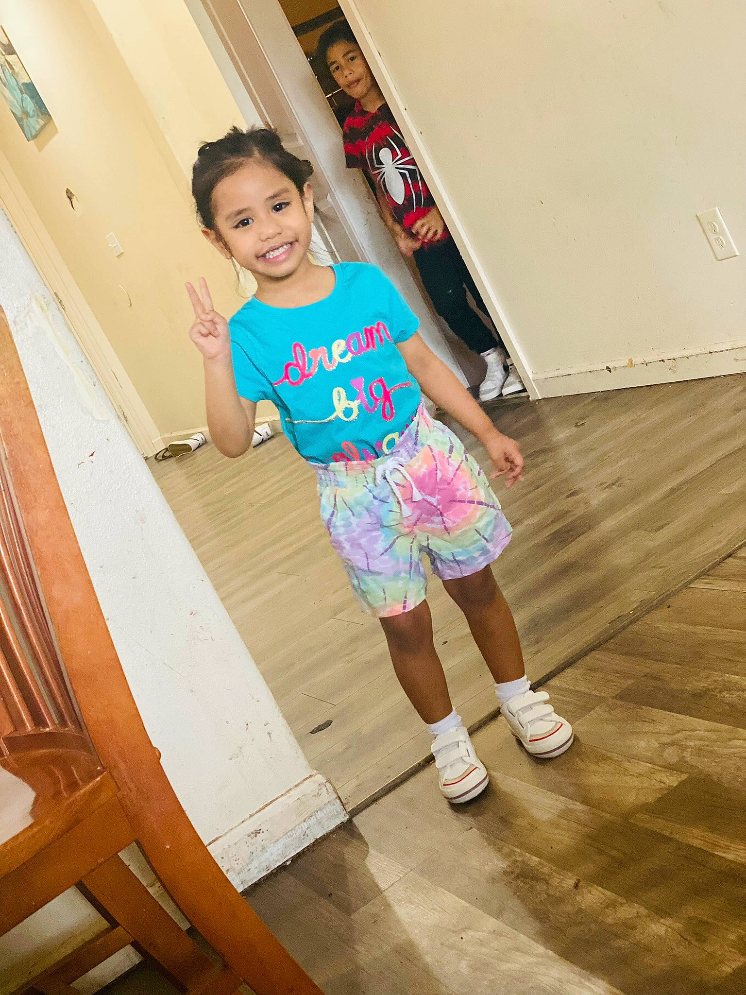 Moana joined the competition — help win amazing prizes! child, floor, flooring, fun, happy, hardwood, human_leg, joy, knee, leisure, person, room, shorts, smile, sock, stairs, standing, t_shirt, thigh, toddler