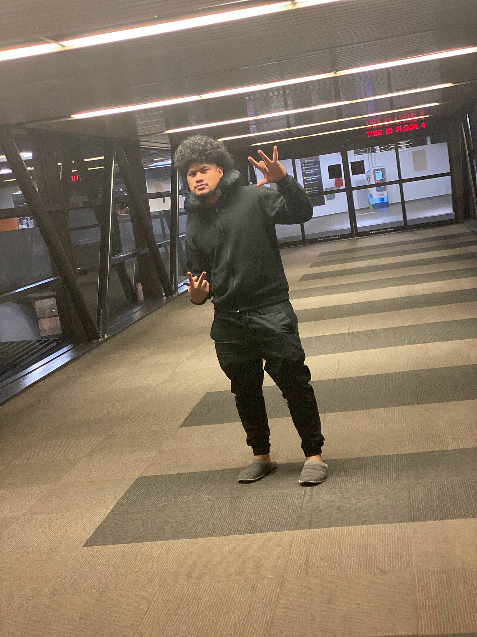 Moana is registered to the contest to win money with this photo: asphalt, bag, boot, city, flooring, human_leg, jacket, luggage_and_bags, metro_station, passenger, pedestrian, person, public_transport, road, shadow, standing, street, tints_and_shades, train_station, travel