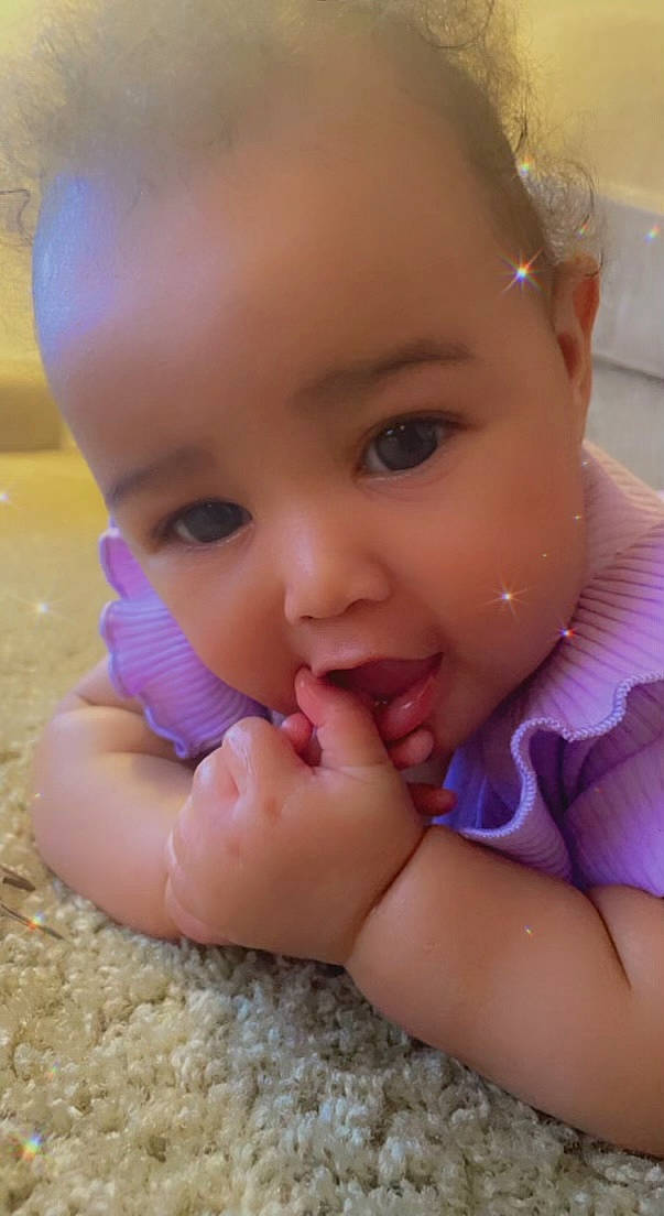 Malayiah is registered to the contest to win money with this photo: arm, baby_toddler_clothing, cheek, chin, ear, eyebrow, eyelash, finger, gesture, hand, happy, iris, lip, mouth, neck, nose, person, pink, skin, thumb