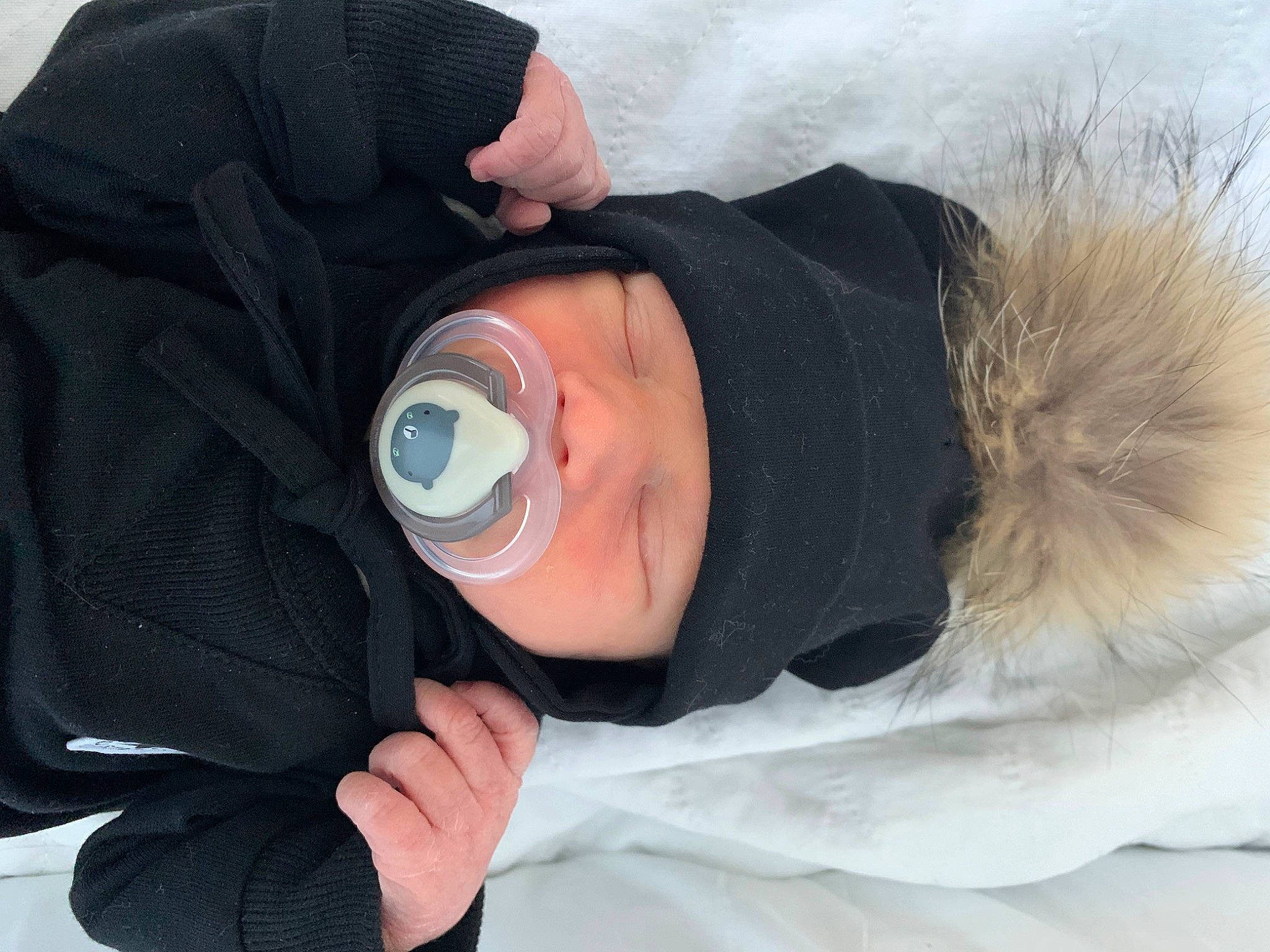 Mayson participe au concours pour gagner de l'argent avec cette photo : baby, beanie, cap, child, comfort, fashion_accessory, freezing, fur, hat, headwear, hood, hoodie, jacket, outerwear, parka, person, personal_protective_equipment, sleeve, snow, toddler