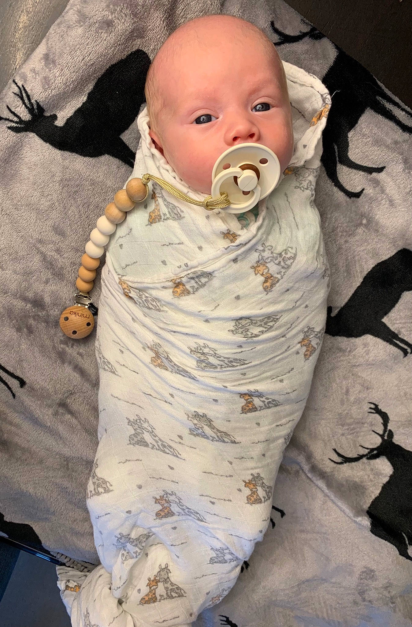 Mayson participe au concours pour gagner de l'argent avec cette photo : arm, art, baby, baby_products, baby_safety, baby_sleeping, baby_toddler_clothing, bib, cheek, child, comfort, eye, head, headgear, infant_bodysuit, linens, pattern, person, sitting, sleeve