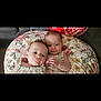 baby, infant, twin, pillow, floral, couch, clothing, cute, portrait, child, toddler, resting, two_people, indoors, soft, skin, head, face, closeup, comfort