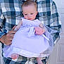 baby, man, plaid_shirt, holding, dress, lavender, infant, portrait, outdoor, person, casual_clothing, cute, child, young, family, hands, feet, expression, gentle, background