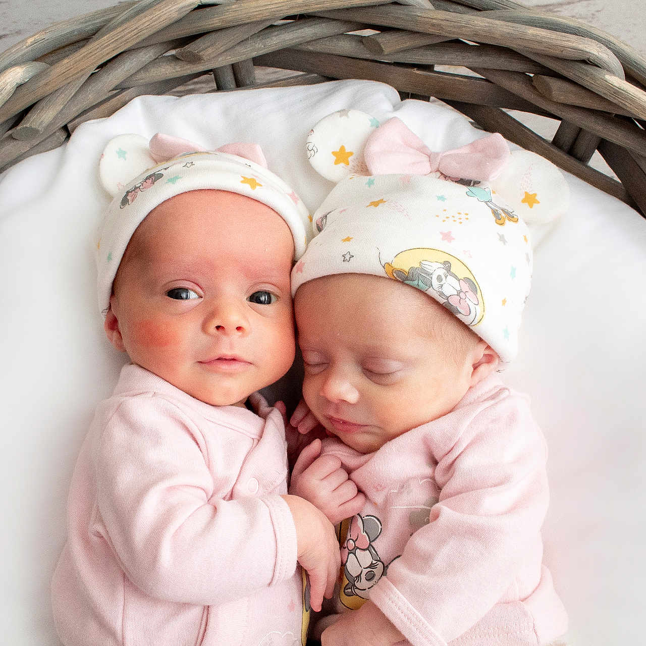 Kaiya And Delilah joined the competition — help win amazing prizes! adorable, awake, baby, basket, child, closeup, cozy, curious, cute, hat, indoor, infant, matching_outfits, newborn, pink_clothing, portrait, sleep, sleeping, soft, twins