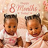 Zo'Lani joined the competition — help win amazing prizes! baby, twins, infant, braided_hair, hair_accessories, pink_blanket, teddy_bear, flowers, decor, celebration, milestone, cute, indoors, soft_lighting, portrait, child, smiling, happy, sitting, cozy