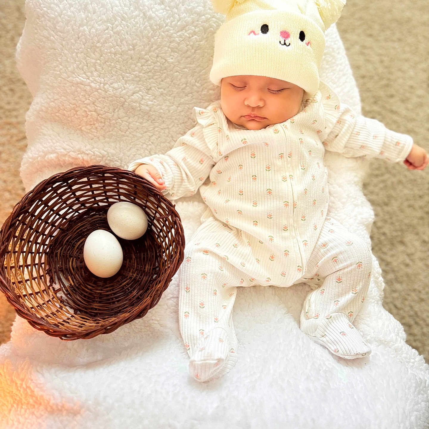 Adhara Luciana is registered to the contest to win money with this photo: adorable, baby, basket, blanket, carpet, child, cozy, cute, eggs, hat, headwear, indoor, infant, onesie, peaceful, resting, sleeping, soft_texture, wearing, white