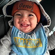 Geno is registered to the contest to win money with this photo: baby, baseballcap, bodypart, cap, clothing, coat, cushion, face, happy, hat, head, homedecor, hood, jacket, mouth, person, photography, portrait, smile, teeth
