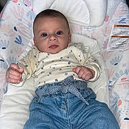 Alia participe au concours pour gagner de l'argent avec cette photo : baby, infant, face, blue_eyes, onesie, floral_pattern, bouncer, baby_seat, blanket, denim, jeans, striped_belt, hands, portrait, indoor, soft_lighting, patterned_fabric, pink, calm_expression, gaze