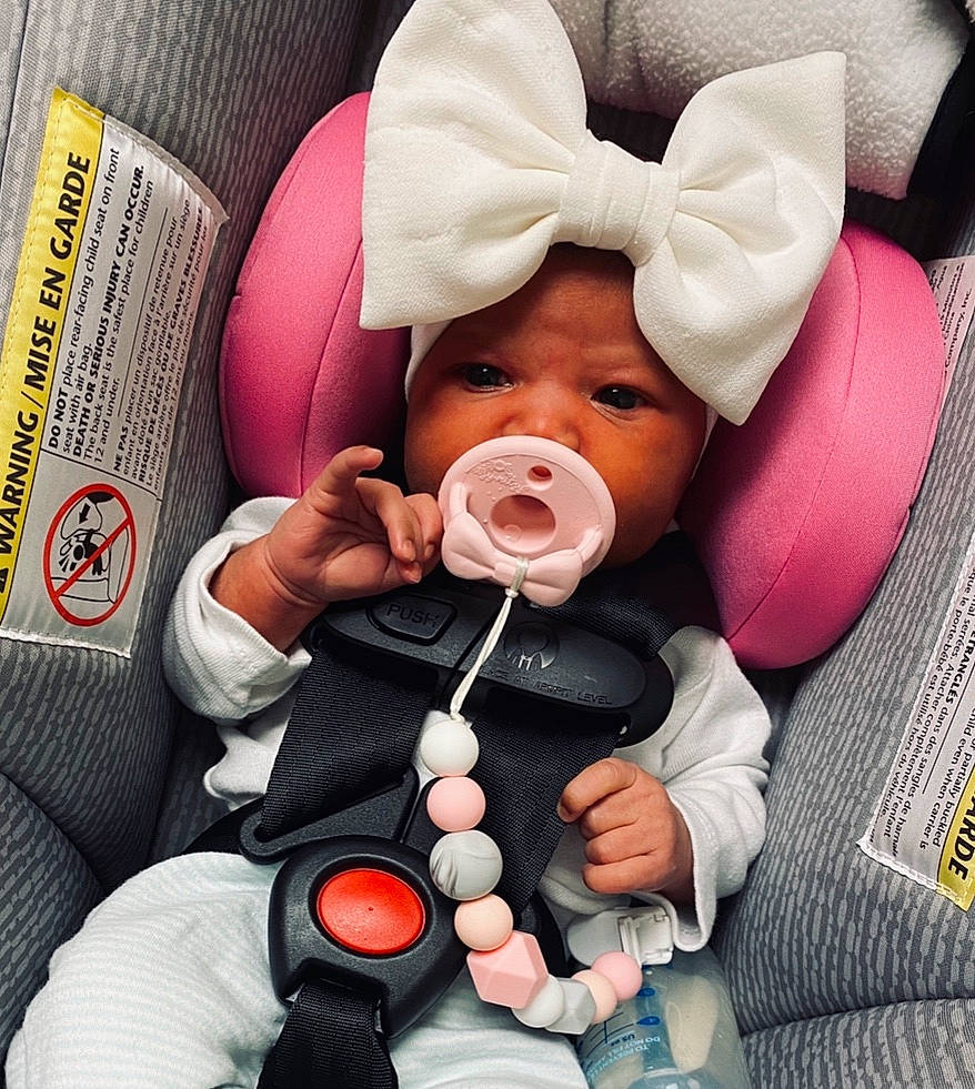 Kehlani is registered to the contest to win money with this photo: baby, baby_in_car_seat, baby_products, car_seat, child, ear, happy, headwear, nose, person, photography, product, seat_belt, smile, toddler