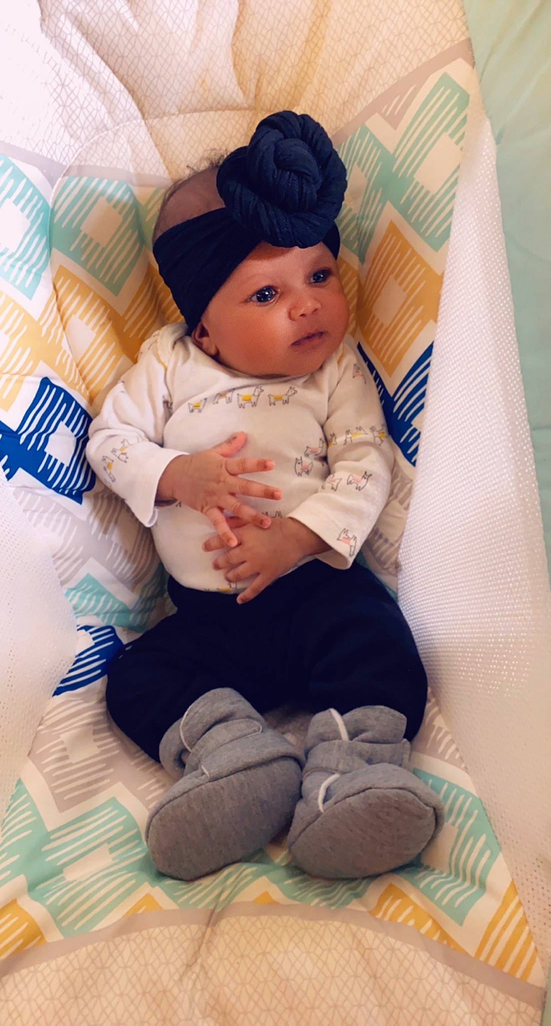 Kehlani joined the competition — help win amazing prizes! baby, black_hair, cheek, child, forehead, head, headgear, headwear, person, sitting, skin, sleeve, smile, toddler