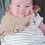 Ava a rejoint le concours — aidez-le/la à gagner de superbes lots ! baby, bib, cheeks, child, clothing, cute, eyes, face, green_shirt, head, holding, indoor, infant, onesie, person, portrait, skin, smile, striped, young