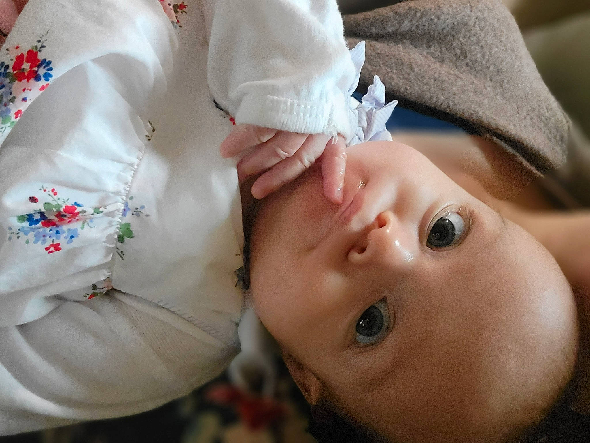 Penny is registered to the contest to win money with this photo: baby, baby_toddler_clothing, cheek, dress, eyebrow, eyelash, facial_expression, hand, happy, hat, headgear, human, lip, nose, person, plant, product, skin, sleeve, smile