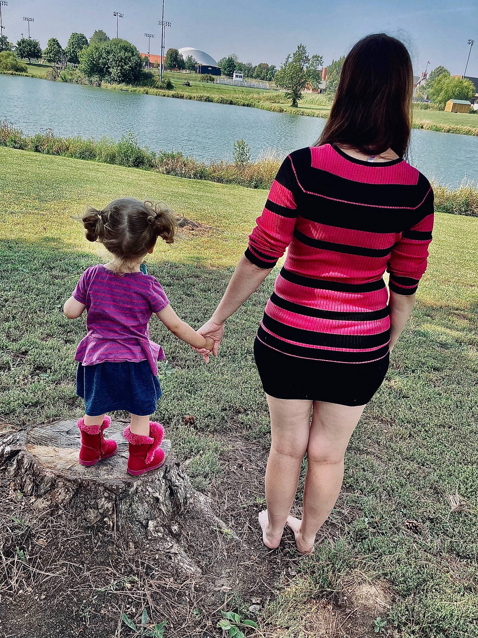 Larissa joined the competition — help win amazing prizes! child, fun, gesture, grass, hand, happy, human_body, lake, leg, leisure, magenta, people_in_nature, person, pink, plant, sky, t_shirt, toddler, tree, waist