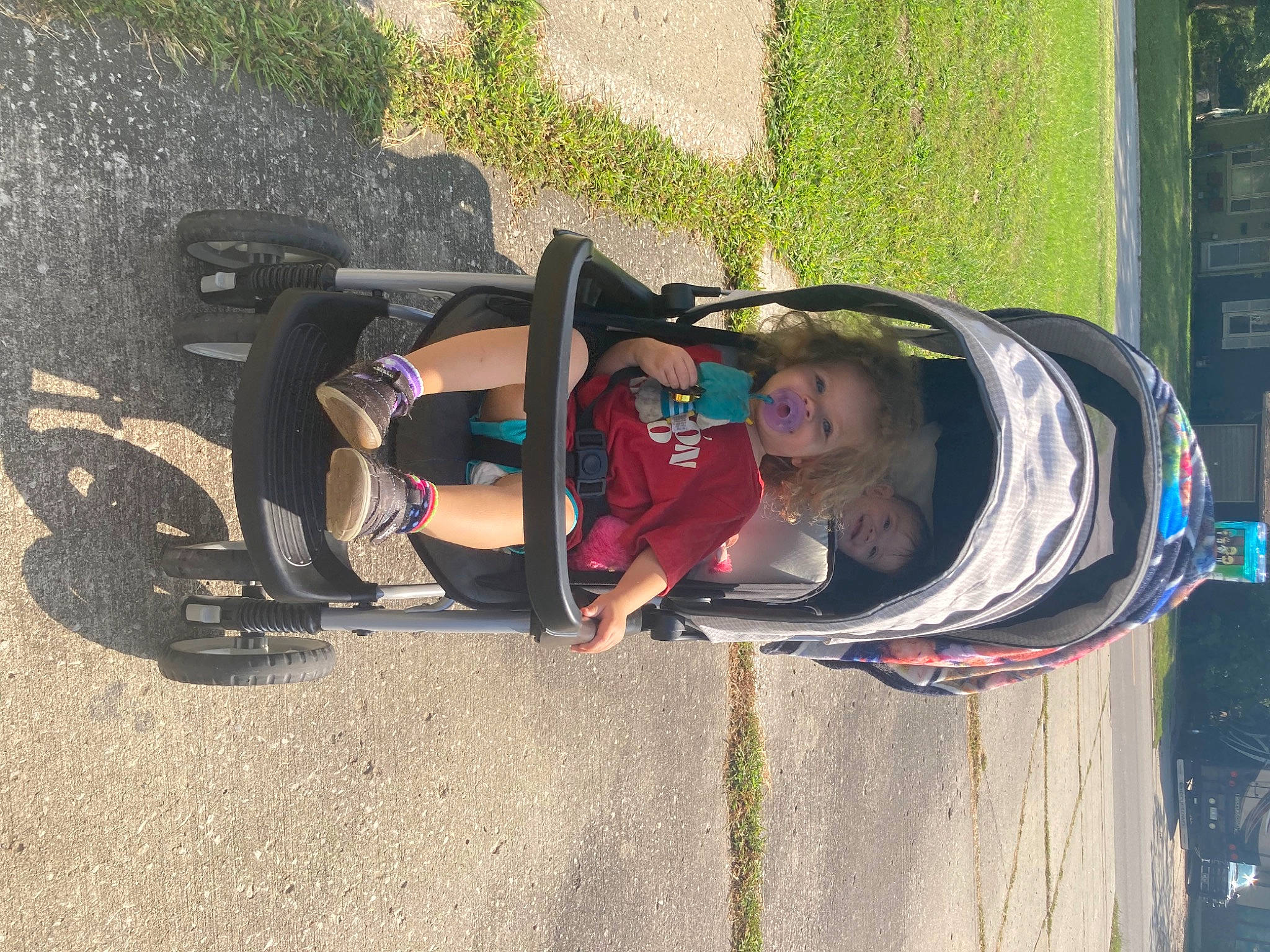 Larissa is registered to the contest to win money with this photo: auto_part, automotive_design, automotive_exterior, bumper, fun, leisure, motor_vehicle, person, plant, recreation, smile, toddler, tree, vehicle, vehicle_door