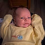 Zackary joined the competition — help win amazing prizes! baby, infant, yellow_clothing, cuddly, face, arms_up, indoor, wooden_chair, curious, expression, human, child, portrait, newborn, soft_lighting, cute, closeup, person, sleeves, blue_sheep