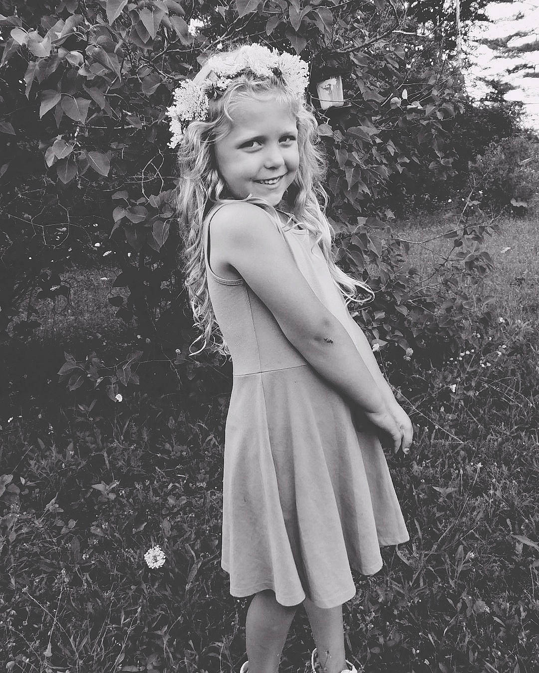 Sky is registered to the contest to win money with this photo: beauty, black_and_white, blond, child, child_model, dress, hair, hair_accessory, hairstyle, headgear, headpiece, joy, long_hair, monochrome, monochrome_photography, person, photo_shoot, photograph, photography, smile
