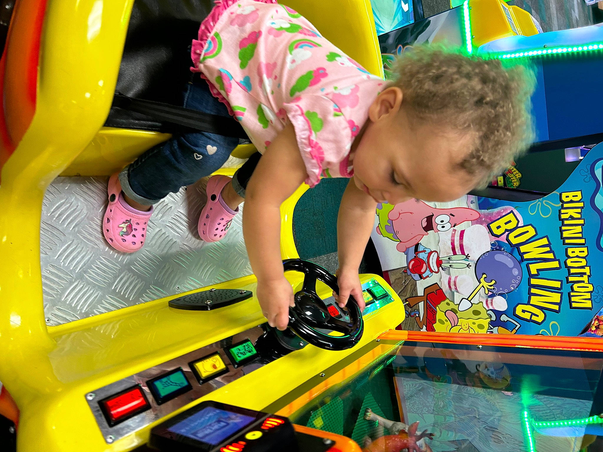 Brooklyn joined the competition — help win amazing prizes! arcade_game, child, engineering, fun, games, green, leisure, machine, person, play, recreation, room, sandal, snapshot, t_shirt, toddler, toy, toy_vehicle, yellow