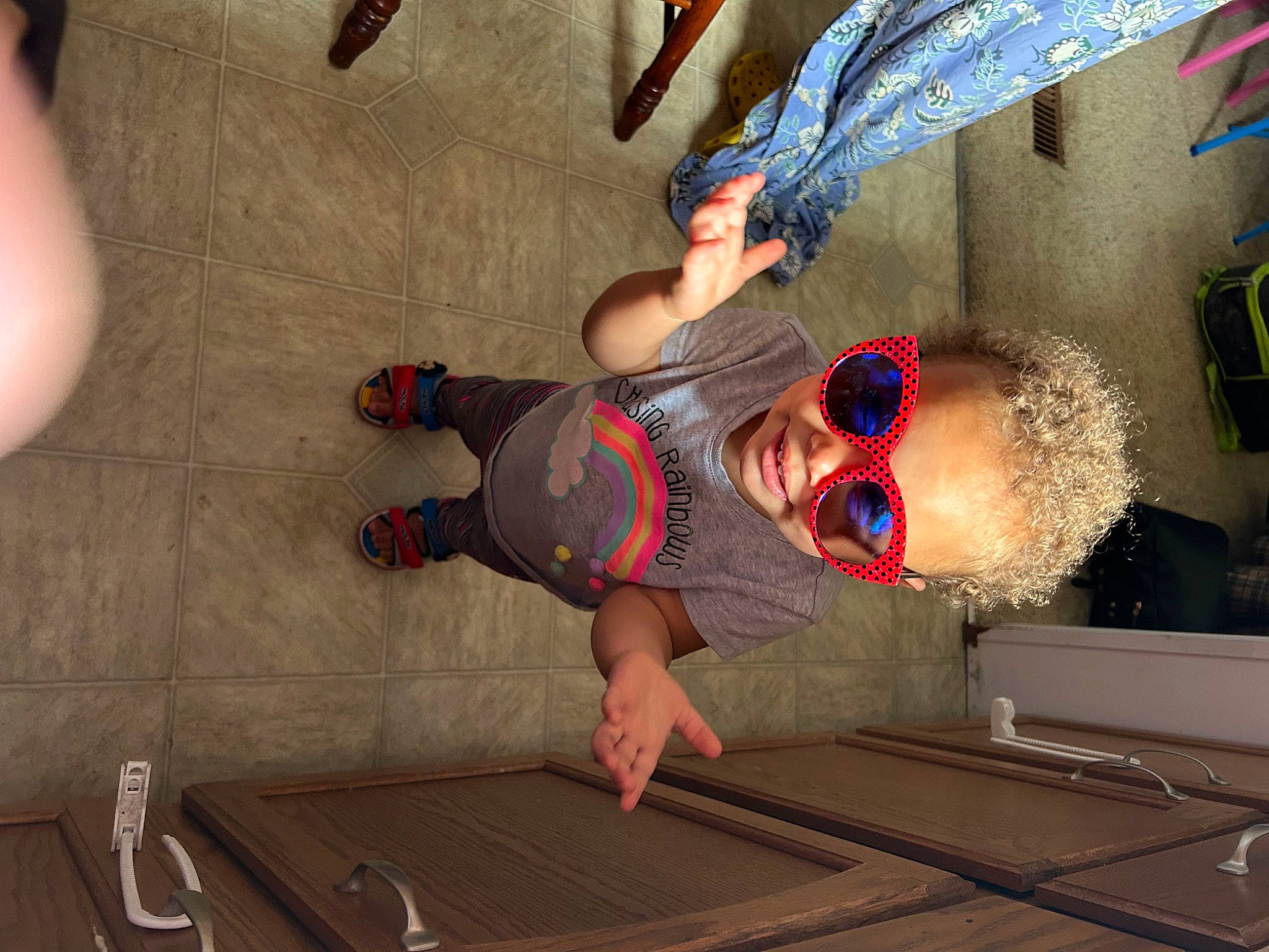 Brooklyn is registered to the contest to win money with this photo: barefoot, elbow, event, flooring, foot, fun, hat, human_leg, knee, leg, leisure, nail, person, room, t_shirt, thigh, thumb, walking_shoe, wood, wrist