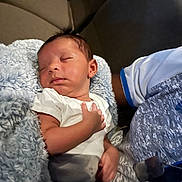 Kingston is registered to the contest to win money with this photo: baby, sleeping, infant, blanket, soft, comfort, hand, white_clothing, couch, person, rest, peaceful, indoor, closeup, skin, young_child, nap, relaxation, cute, portrait