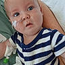 Ryder joined the competition — help win amazing prizes! baby, infant, child, nasal_tube, iv_line, hospital, medical_care, striped_clothing, blue_eyes, person, arm, bed, white_cloth, healthcare, closeup, young_child, curious, indoor, resting, caregiver