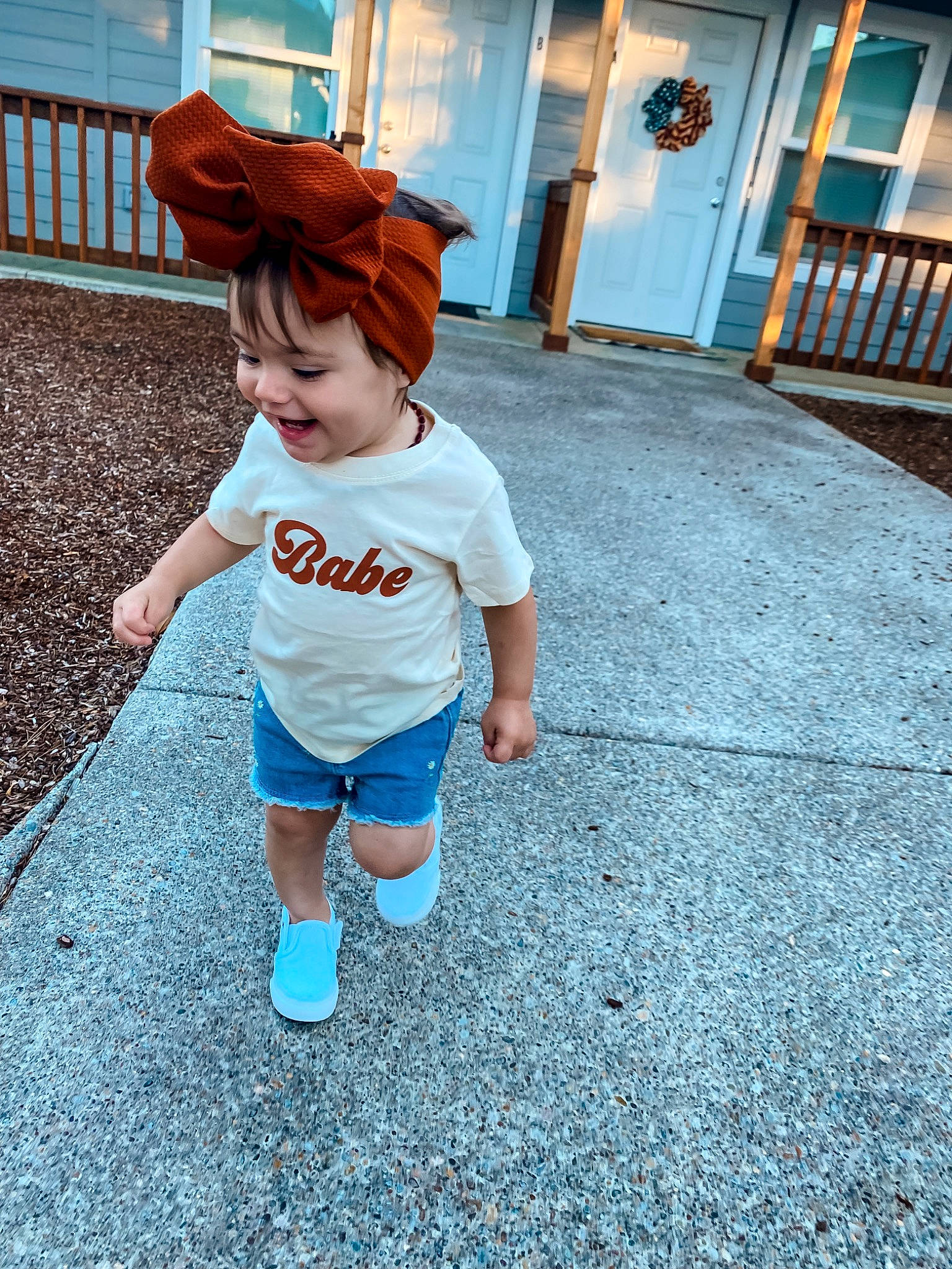 Paityn joined the competition — help win amazing prizes! azure, blue, child, cool, electric_blue, flooring, fun, grass, happy, hat, human_leg, leisure, person, recreation, sitting, sleeve, street_fashion, t_shirt, thigh, toddler