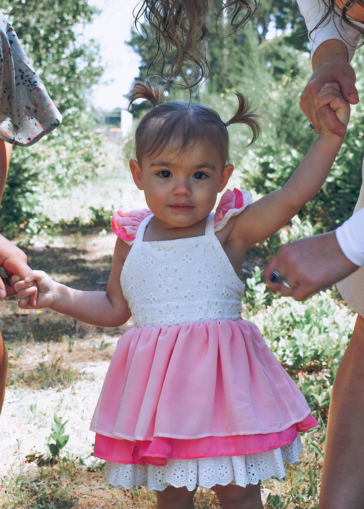 Paityn is registered to the contest to win money with this photo: adaptation, baby_toddler_clothing, child, face, gesture, grass, hairstyle, hand, happy, leaf, leisure, magenta, people_in_nature, person, pink, plant, recreation, skin, summer, toddler