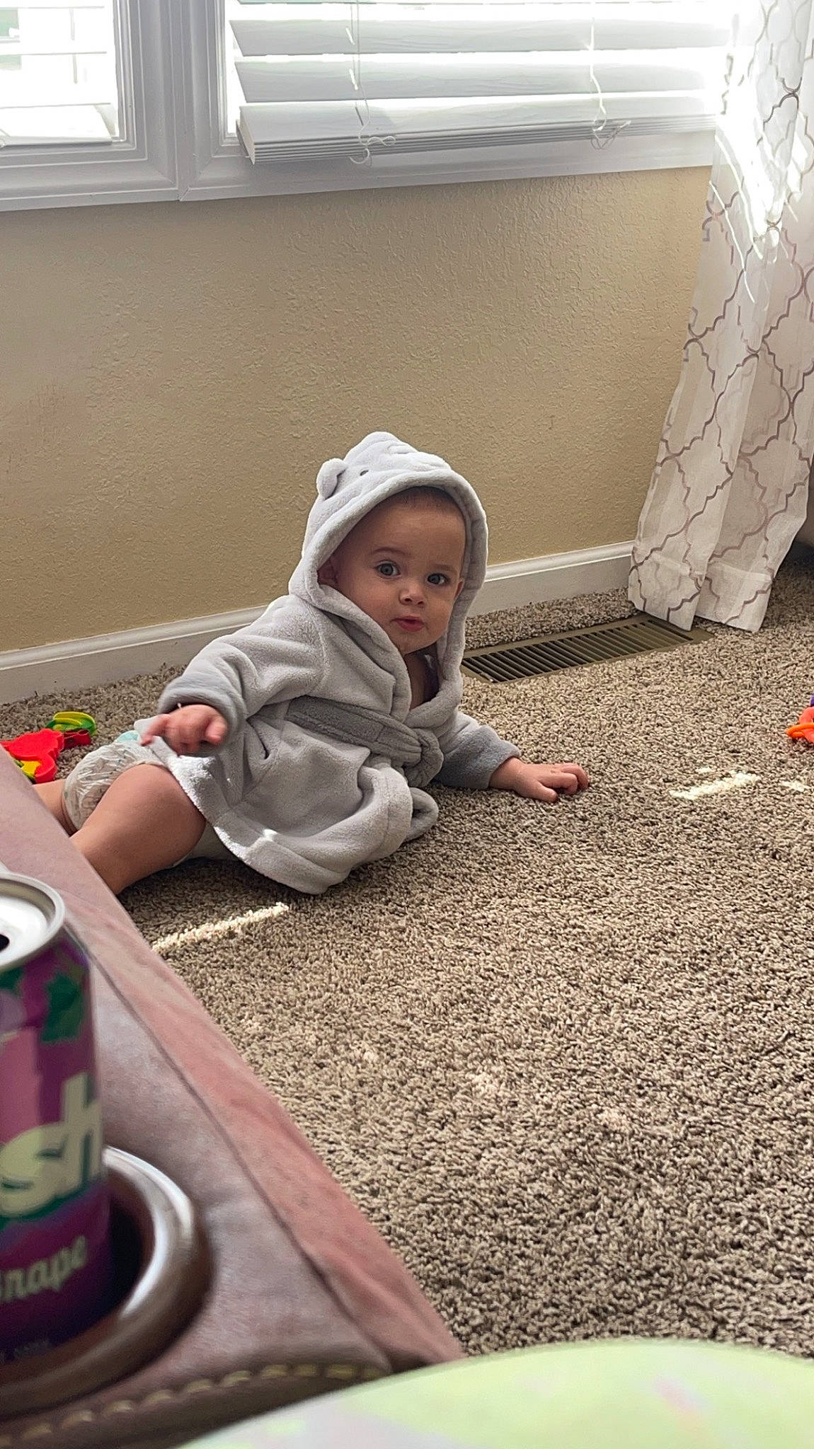 Azrael is registered to the contest to win money with this photo: asphalt, baby, cap, carmine, child, concrete, floor, flooring, fun, grass, landscape, person, play, road_surface, room, sitting, soil, tin_can, tints_and_shades, toddler