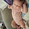 baby, infant, sleeping, child, striped_bodysuit, couch, blanket, stuffed_toy, portrait, indoor, nap, relaxed, lying_down, face, closed_eyes, hands, legs, home, soft_furnishings, photography