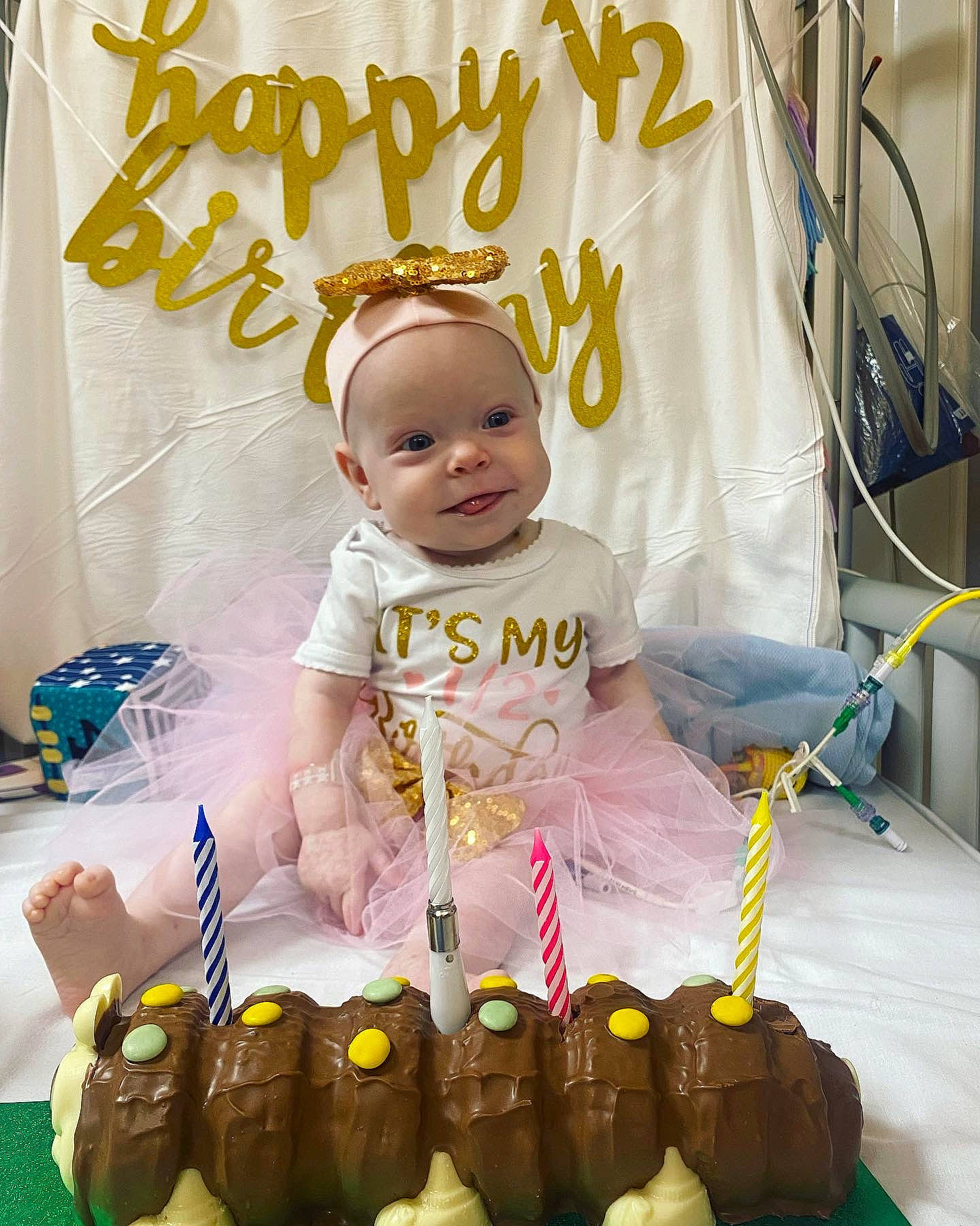 Aila is registered to the contest to win money with this photo: baby, baby_products, baby_toddler_clothing, baby_toys, basket, child, comfort_food, facial_expression, fun, handwriting, happy, party, person, photograph, play, room, sitting, smile, sweetness, toddler