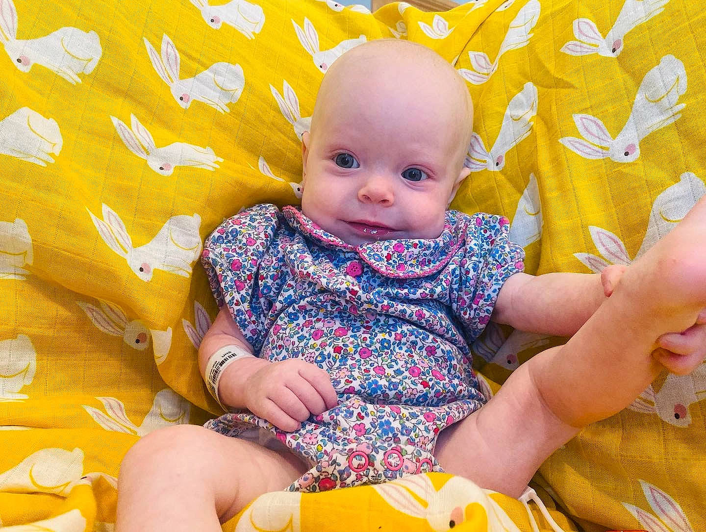 Aila joined the competition — help win amazing prizes! baby, baby_toddler_clothing, cheek, child, comfort, fun, happy, leisure, linens, orange, pattern, people_in_nature, person, playing_with_kids, sitting, skin, sleeve, sock, textile, toddler