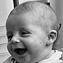 baby, black_and_white, cheerful, child, close_up, clothing, cute, expression, face, happy, head, human, indoors, infant, person, portrait, skin, smiling, toddler, young