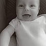 Nahël a rejoint le concours — aidez-le/la à gagner de superbes lots ! baby, infant, smile, happy, onesie, cushion, texture, closeup, face, child, portrait, lying_down, monochrome, black_and_white, indoor, soft_light, cute, young_child, hand, expression