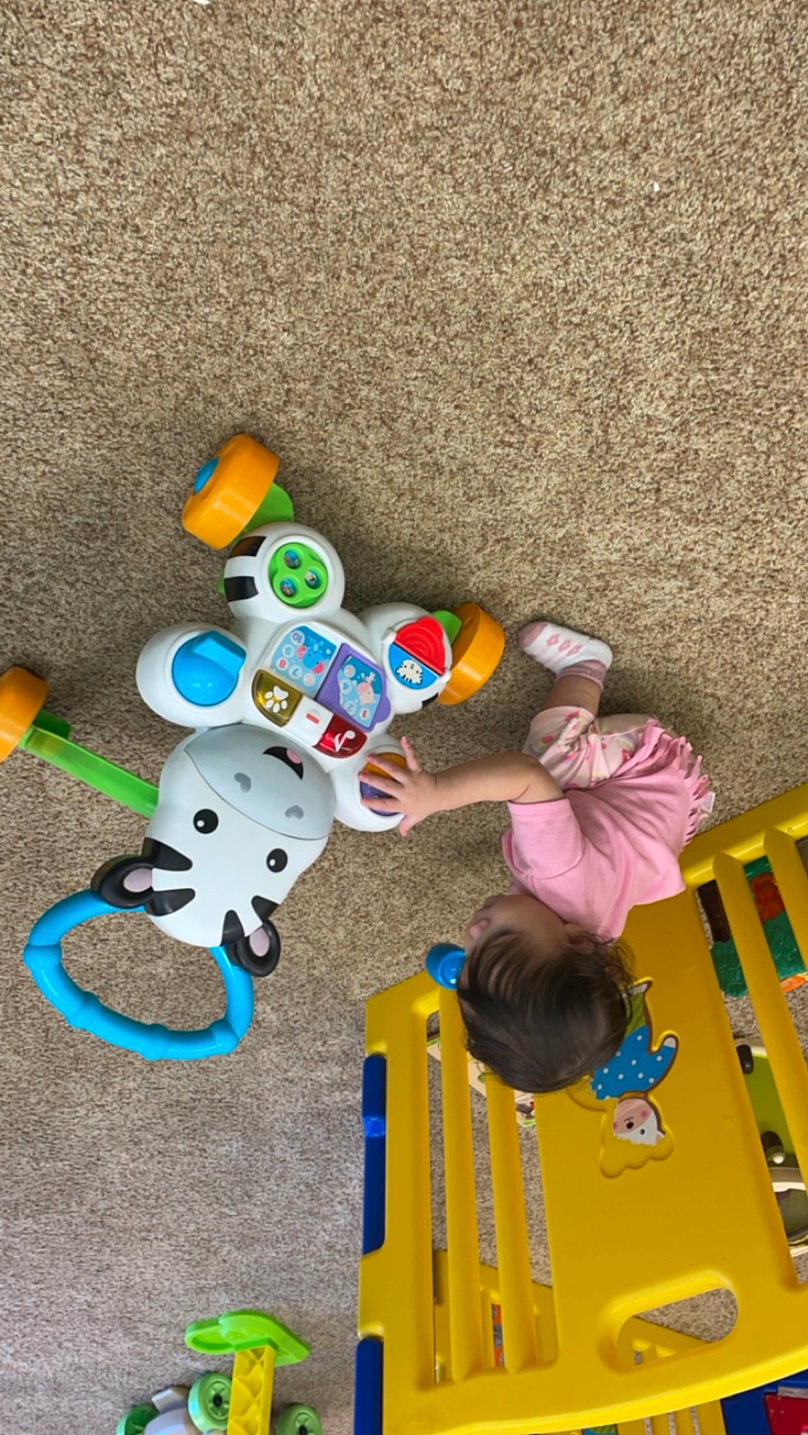 Jaylani is registered to the contest to win money with this photo: baby_toys, child, circle, concrete, flooring, font, fun, games, leisure, paint, person, plastic, play, playground, recreation, room, toddler, toy, visual_arts, wood