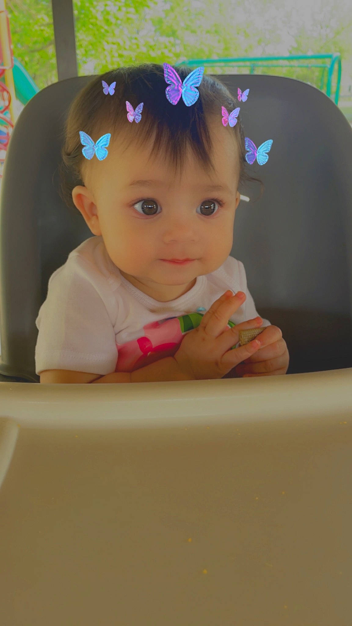Jaylani joined the competition — help win amazing prizes! baby, baby_toddler_clothing, cheek, child, eyelash, fashion_accessory, fun, hair_accessory, happy, headgear, headpiece, lip, magenta, person, pink, room, sitting, skin, sleeve, smile
