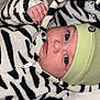 Lyna participe au concours pour gagner de l'argent avec cette photo : baby, child, clothing, cozy, cute, expression, eyes, face, green_hat, hand, hoodie, indoor, infant, newborn, portrait, skin, soft_texture, warm, young, zebra_stripe